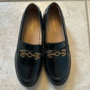 Women’s Deana San Edelman’s black loafers.